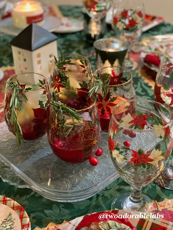 Santas, Poinsettias, Cranberry Sours Table | www.twoadorablelabs.com | #christmas #cranberry #bourbon #santa #poinsettias